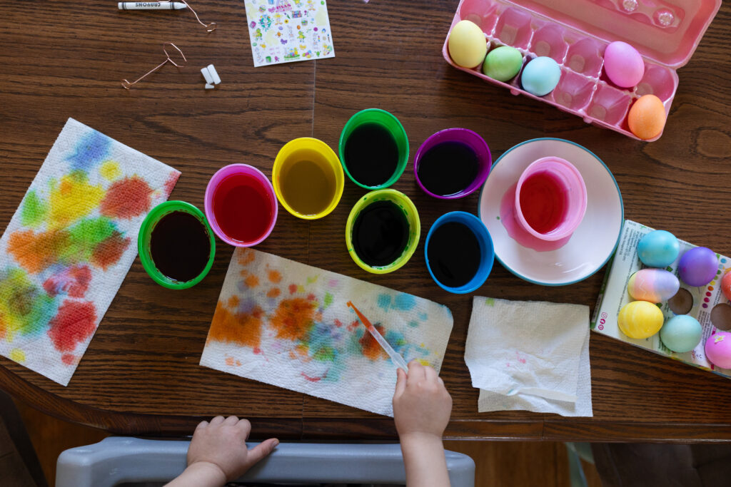 enjoy a family tradition like dyeing Easter eggs - ideas for your Raleigh NC candid documentary photo session capturing your real life
