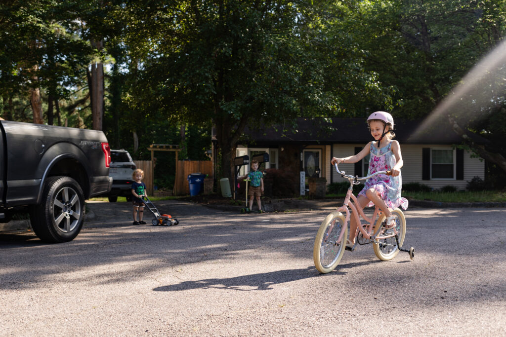 spring family activities to capture during your documentary family photo session in Raleigh NC - ride bikes in the cul-de-sac, in your neighborhood, or on the greenway